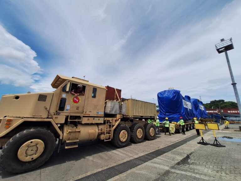 Oshkosh heavy transport vehicle hauling oversized project cargo on a multi-axle trailer