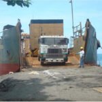 Ansaldo Logistics tractor head positioned on the ramp of a landing craft transport vessel