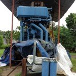Large diesel-powered industrial equipment installed under a protective shelter
