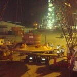 Crane lifting a large mining equipment component during a nighttime operation