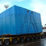 Large covered project cargo secured on a modular multi-axle trailer